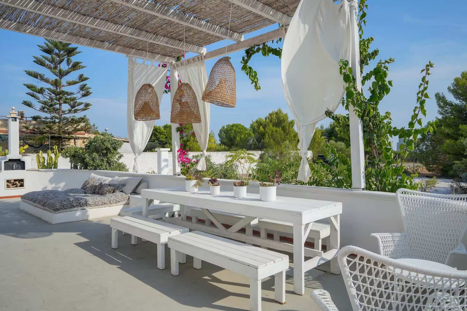 Long dining table under the pergola