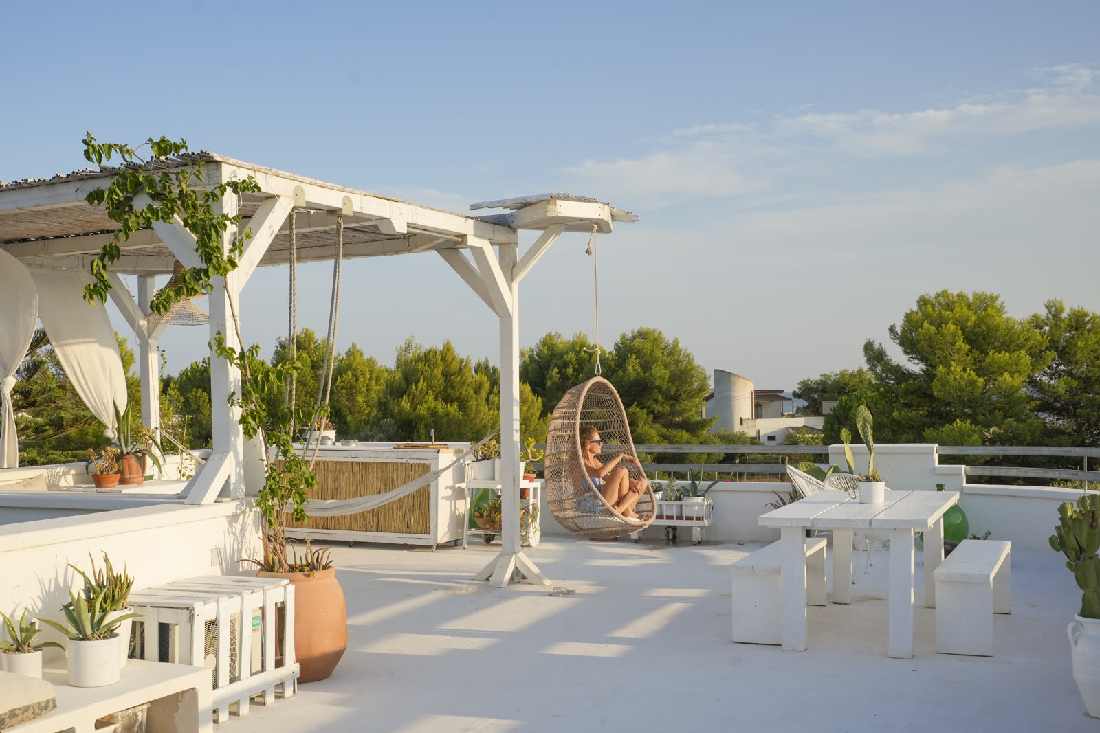 Rooftop terrace with hanging swing chair