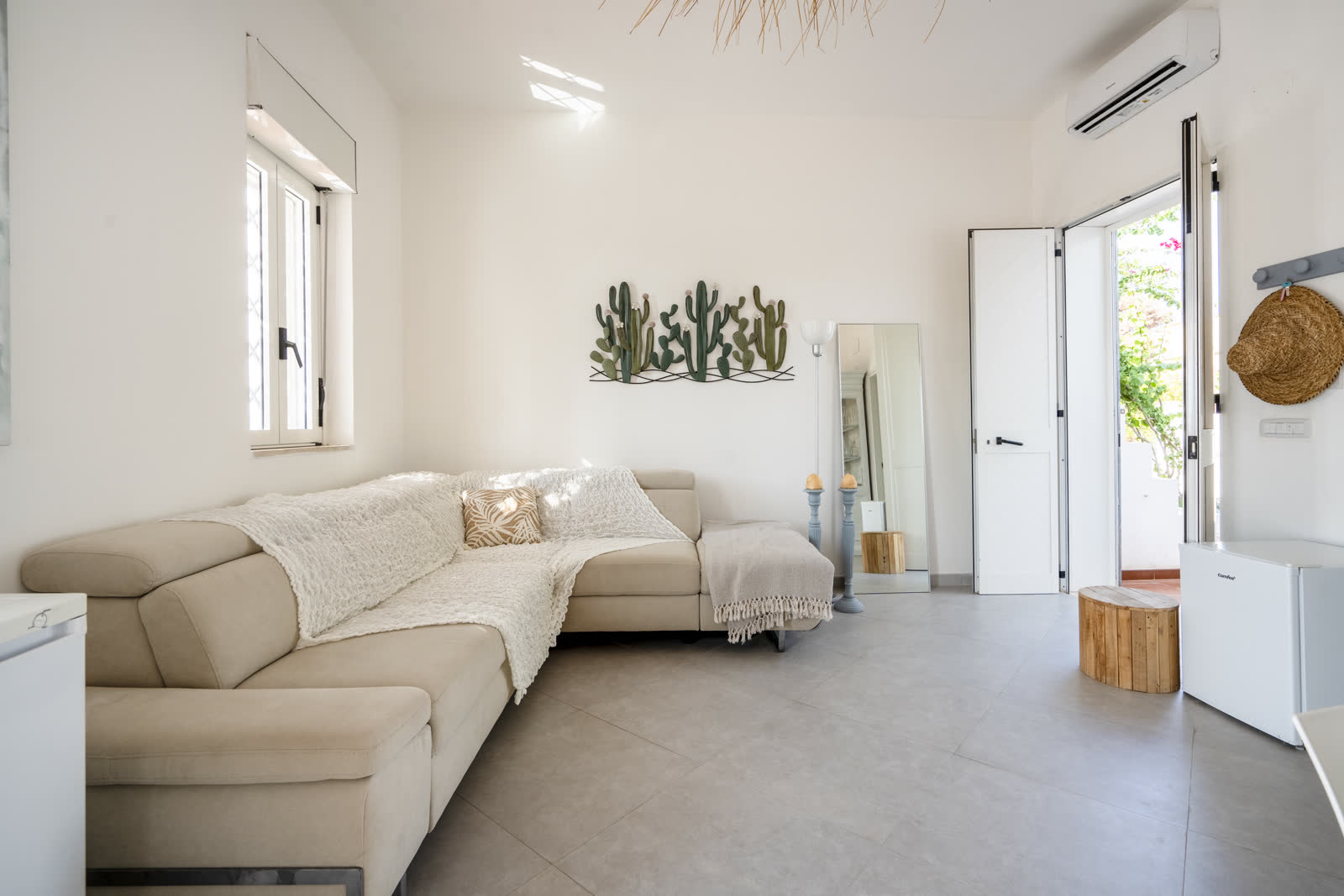 Living room with cactus wall art